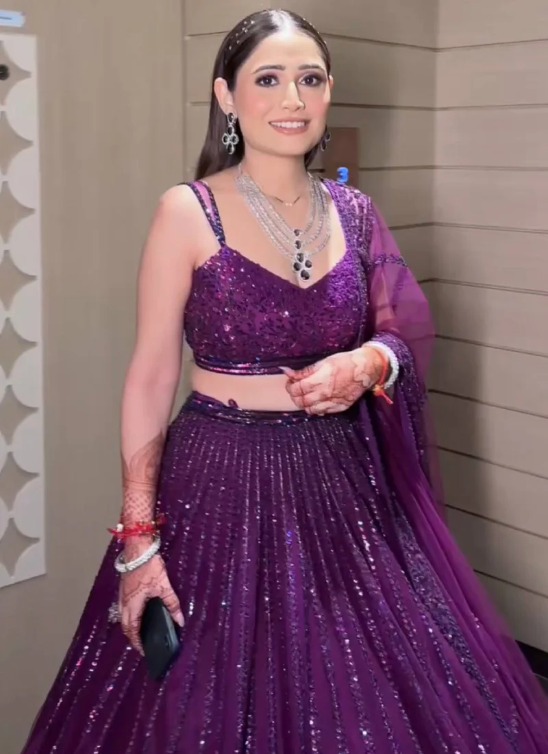 Beautiful Heavy Embroidered Reception Wear Purple Net Lehenga Choli - Image 3